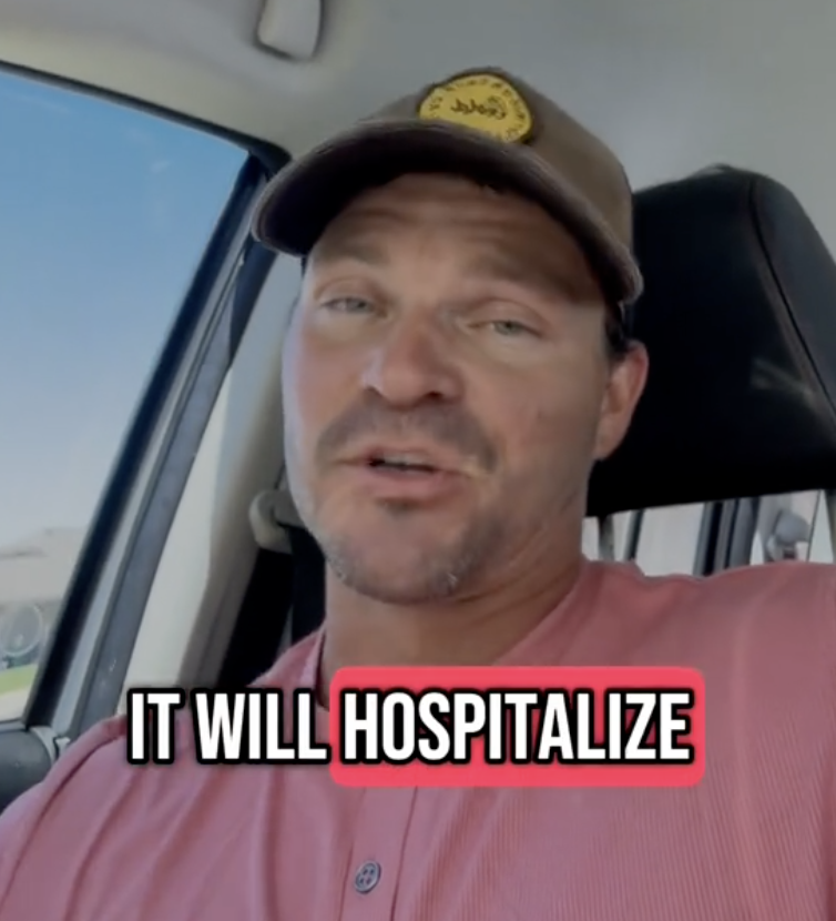 man talking in his car