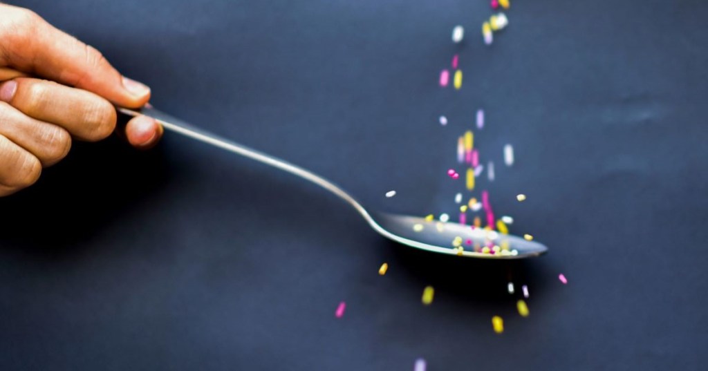 A spoon with hundreds and thousands