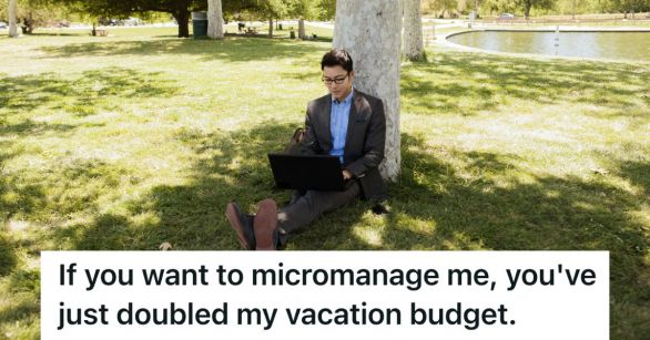 Man on laptop while leaning on a tree