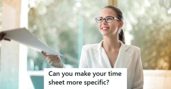 Professional woman smiling as she hands the boss her timesheet