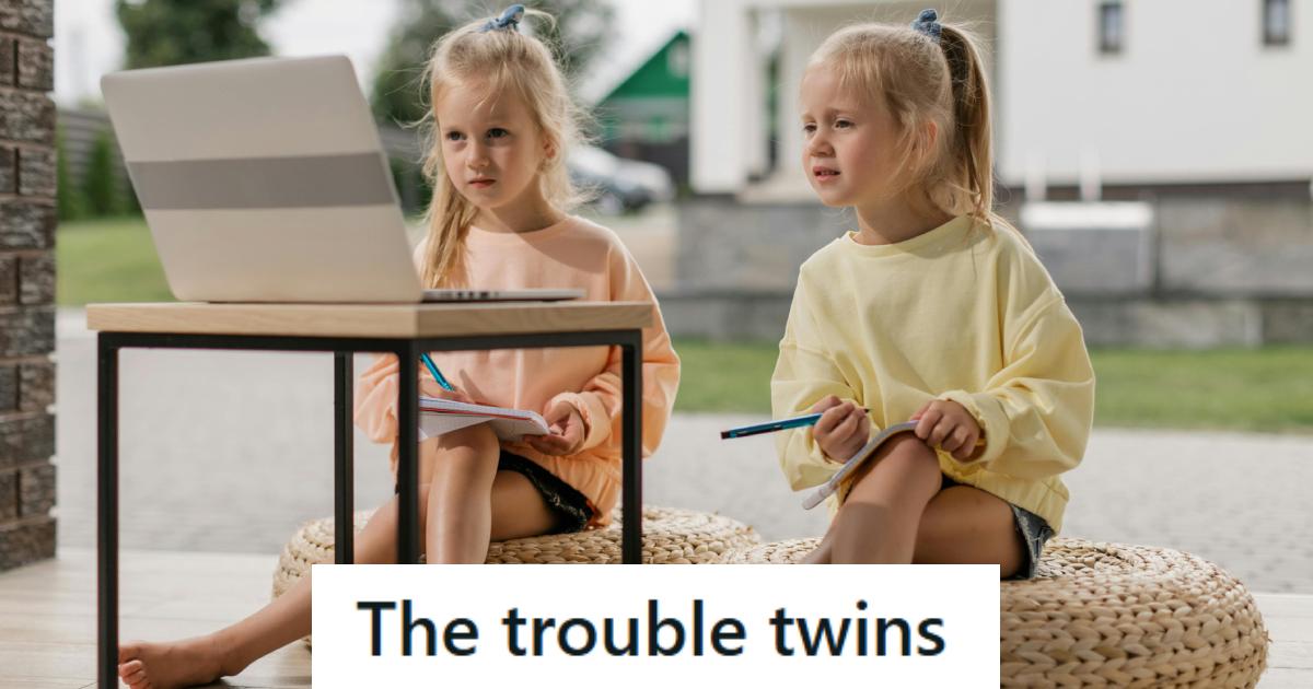 Twin girls with blonde hair having fun together