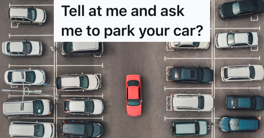 red car driving in a crowded parking lot