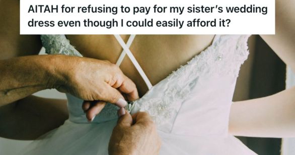 Woman trying on a wedding dress with the help of another person