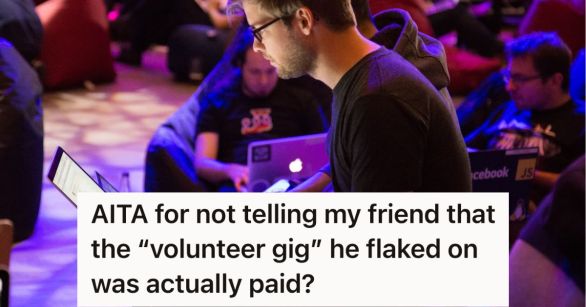 Man sitting on the floor working on his laptop