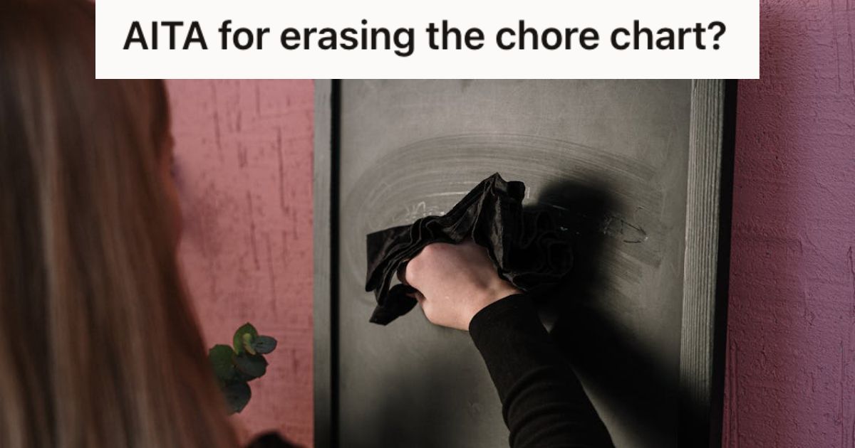 Woman erasing chalkboard with a cloth