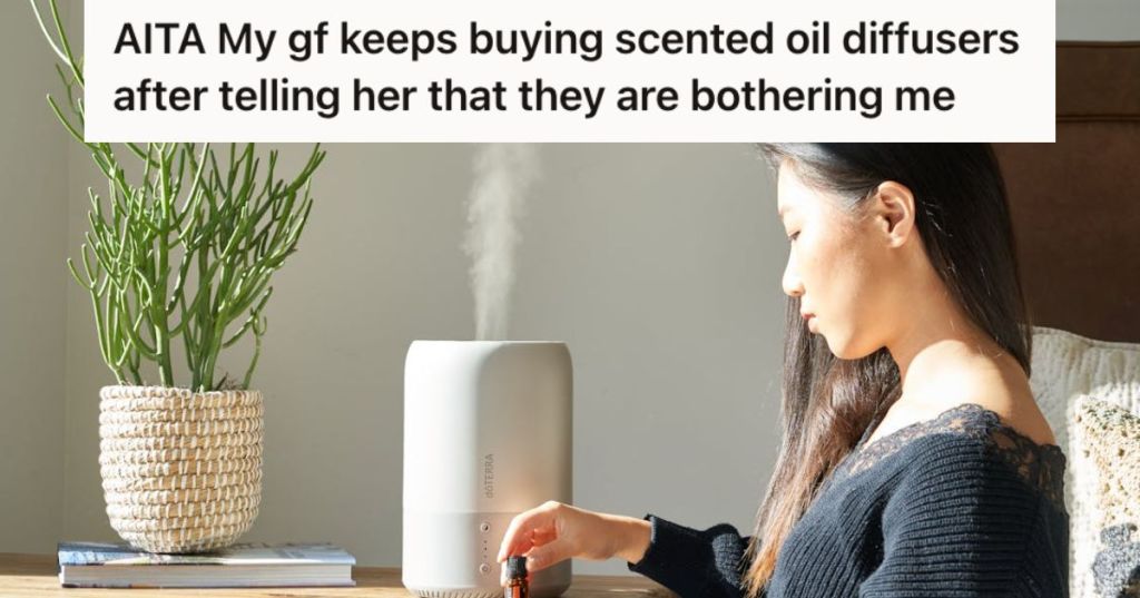 Woman diffusing scented oil using her diffuser