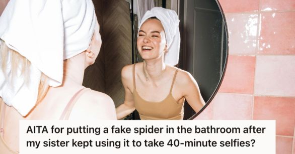 Girl looking at the mirror and smiling at herself