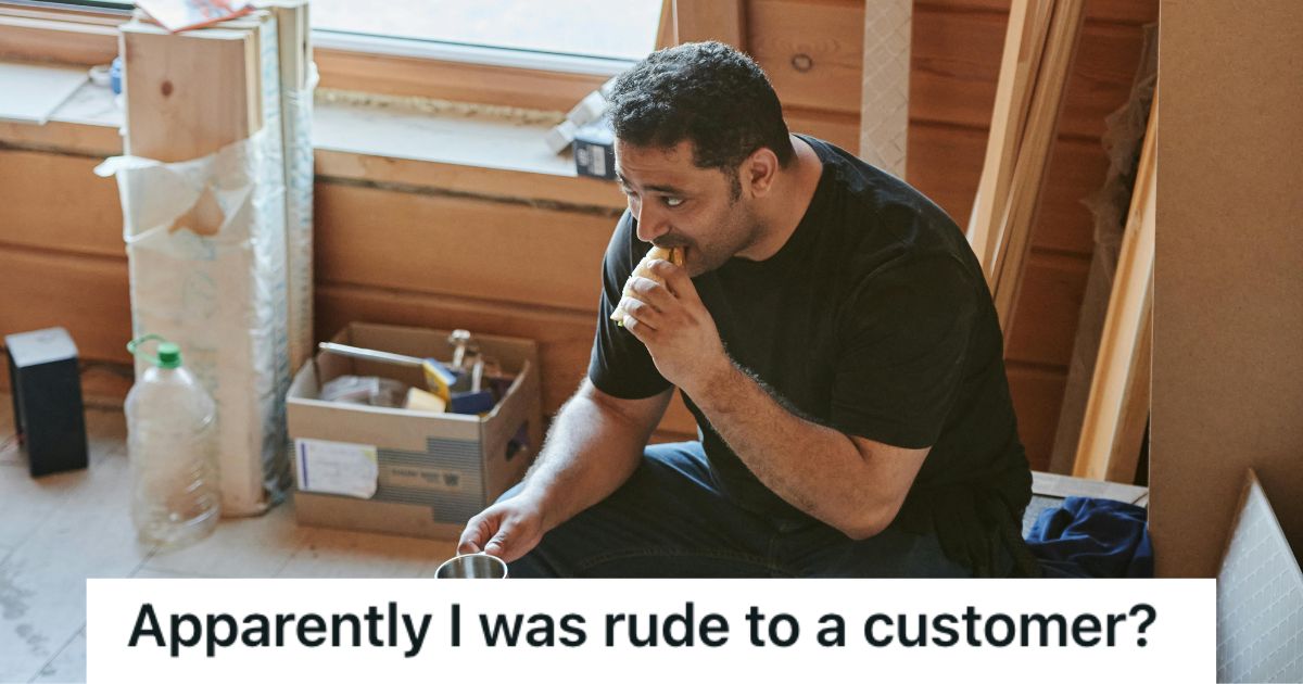 Man eating his sandwich and holding a cup in the break room