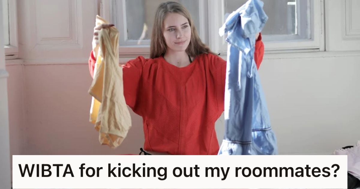 Woman sitting on the floor holding up laundry