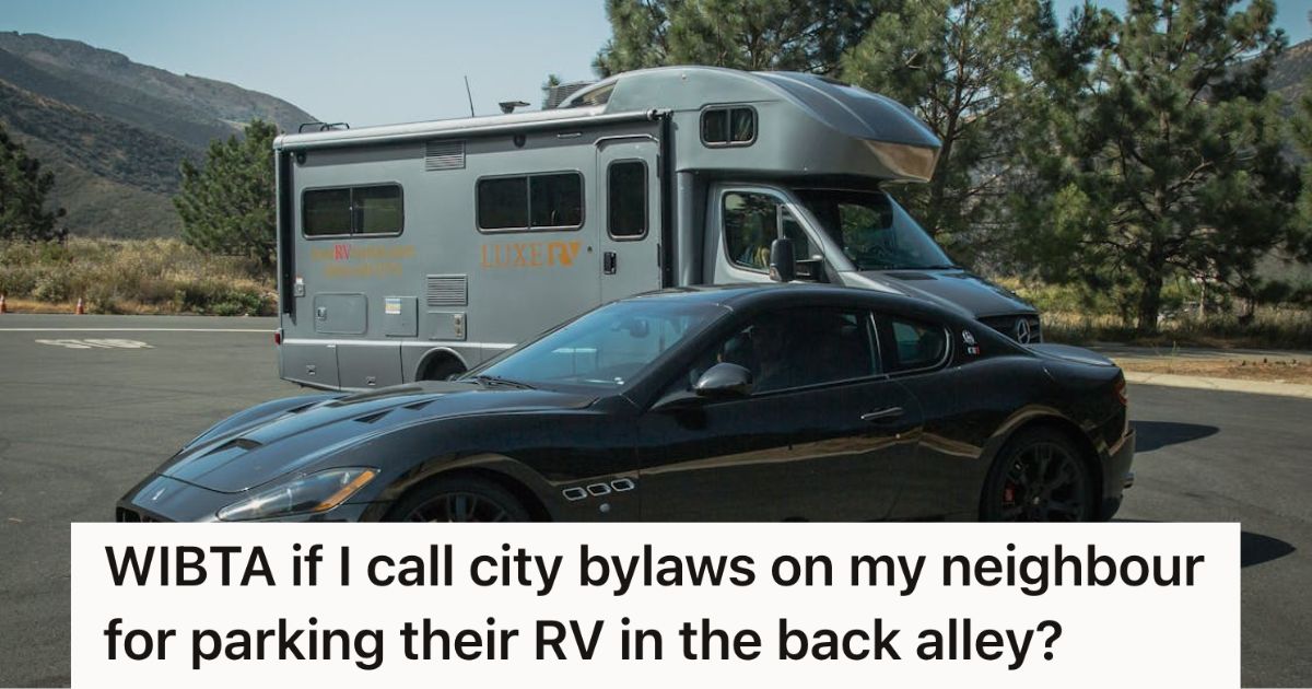 Black car parked in front of an RV