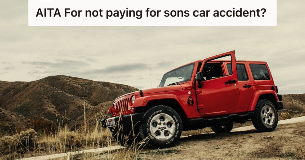 A red Jeep on the side of the road with the door open