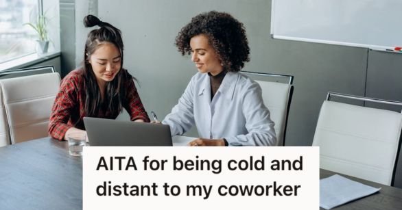 Female coworkers sharing a laptop and dicussing a work-related topic