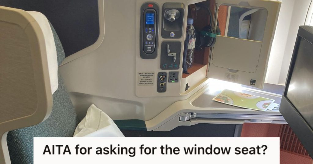 A business class seat in an airplane
