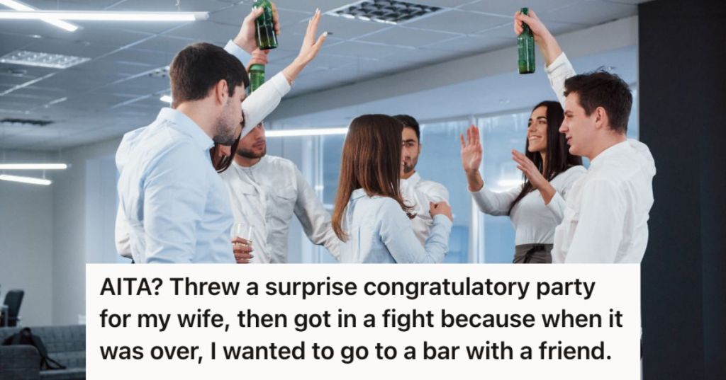 Office celebration with employees holding a bottle of beer