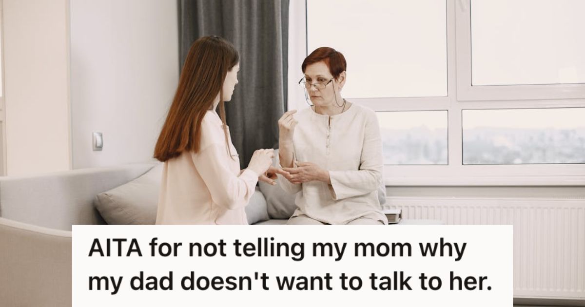 Two women in white talking while sitting on teh couch