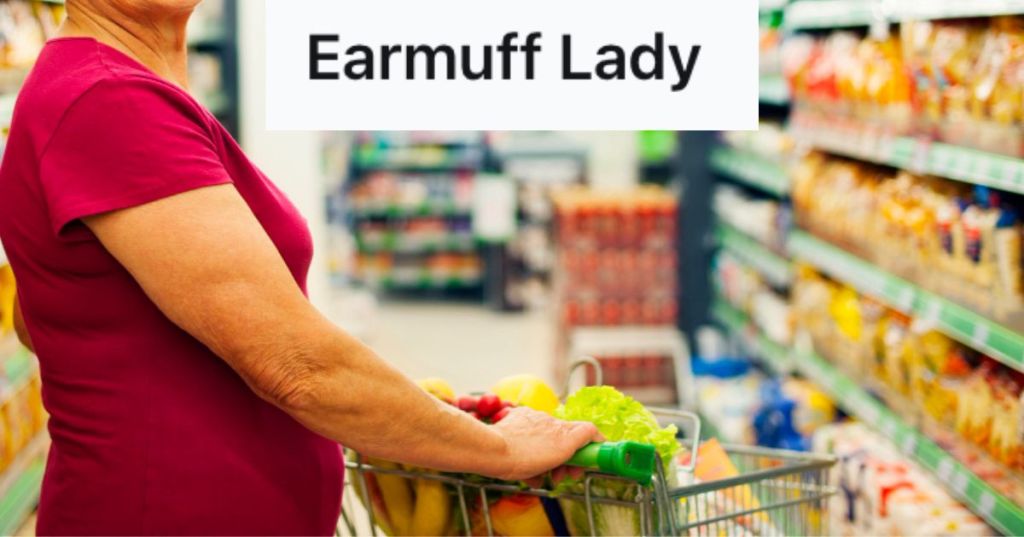 Woman pushing shopping cart in an aisle of the supermarket