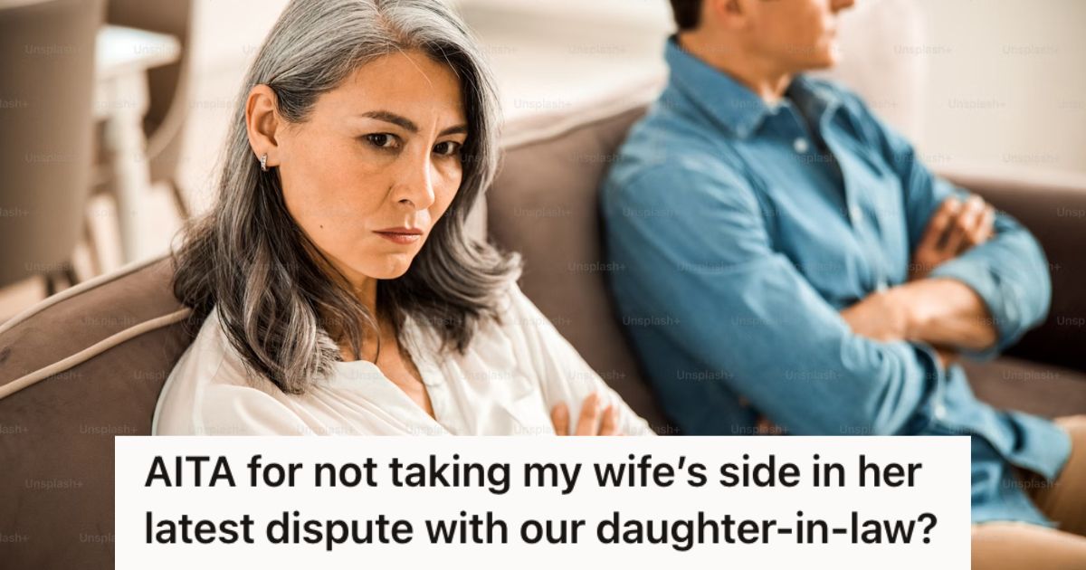 Angry woman sitting next to a man on the couch