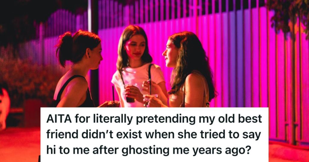 A group of girls standing and talking holding drinks