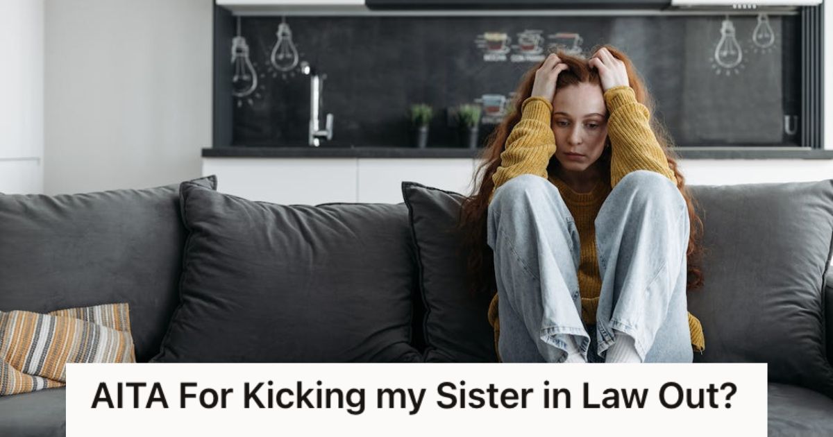 Woman sitting on the couch and touching her head