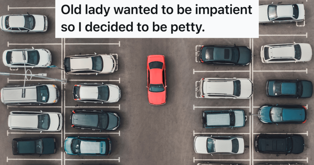 red car driving in a crowded parking lot