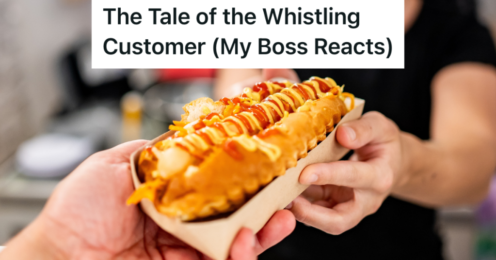 woman handing customer a hotdog