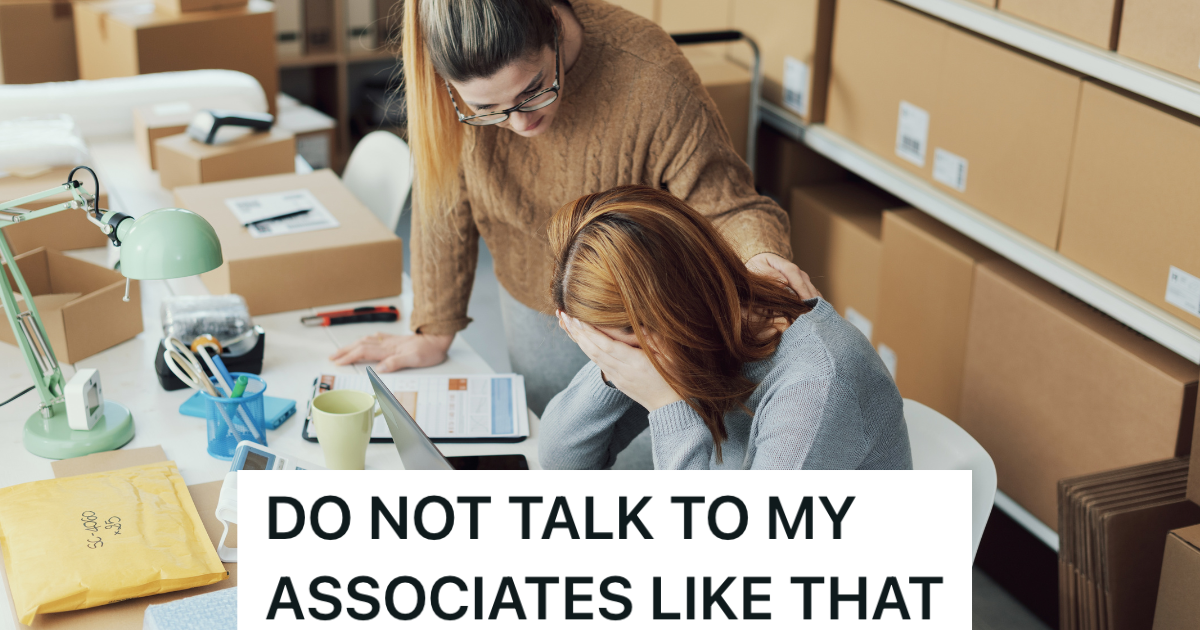 manager comforting upset retail employee