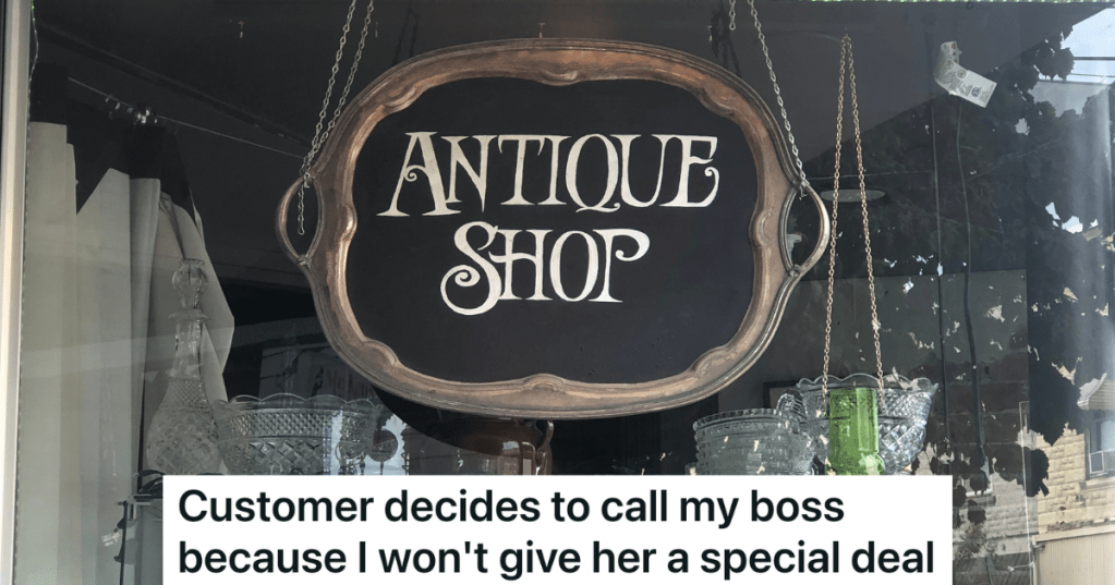 black sign that reads "antique shop"