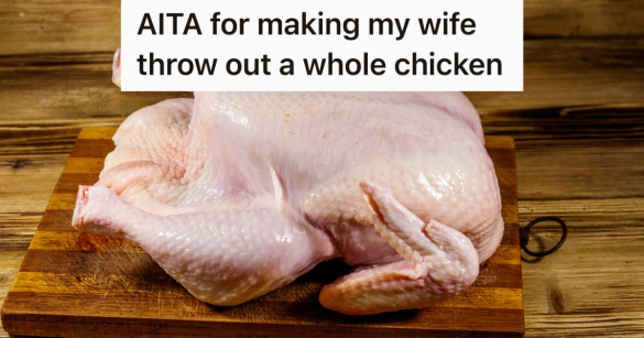 whole raw chicken on a wooden cutting board