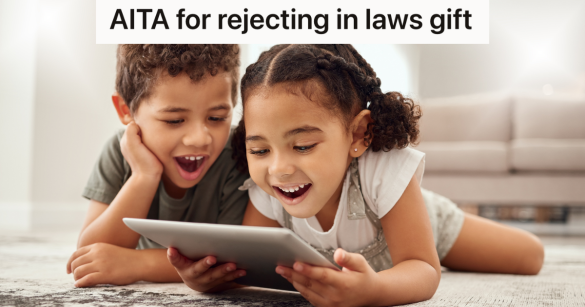 little boy and girl smiling at a tablet