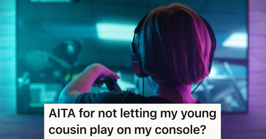 back view of a little boy wearing headphones and playing a video game