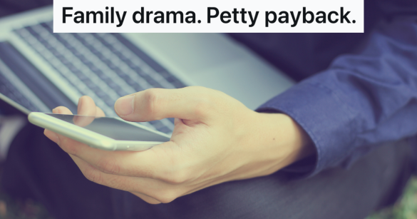 man holding a laptop and phone