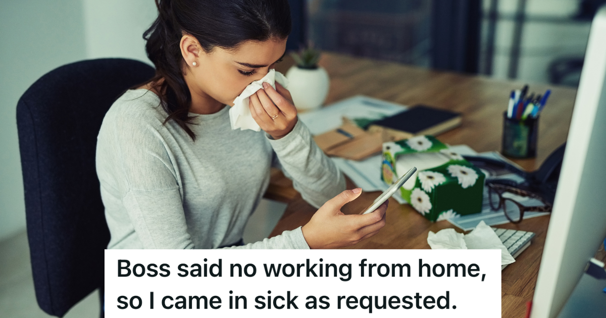 woman blowing her nose at her desk