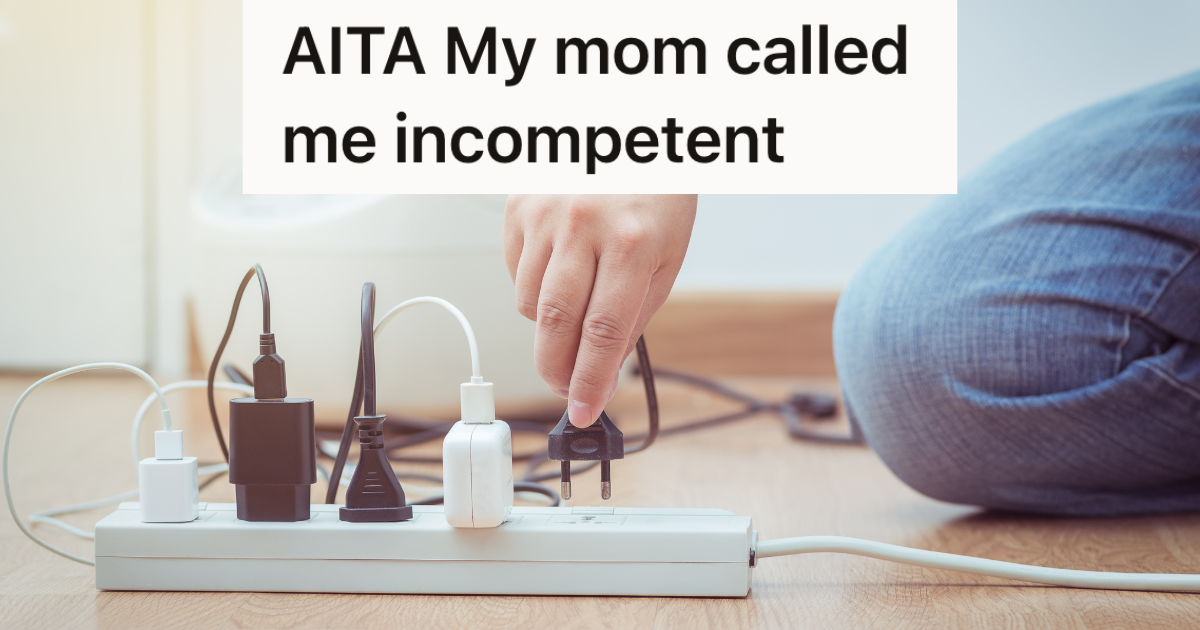 person plugging a cord into a surge protector