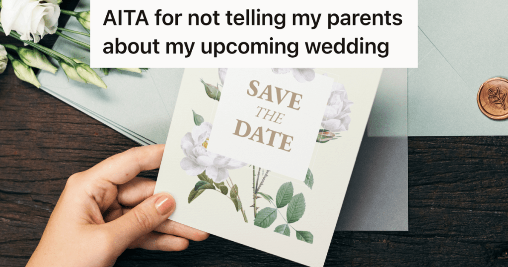 woman's hand holding a card that reads "save the date"