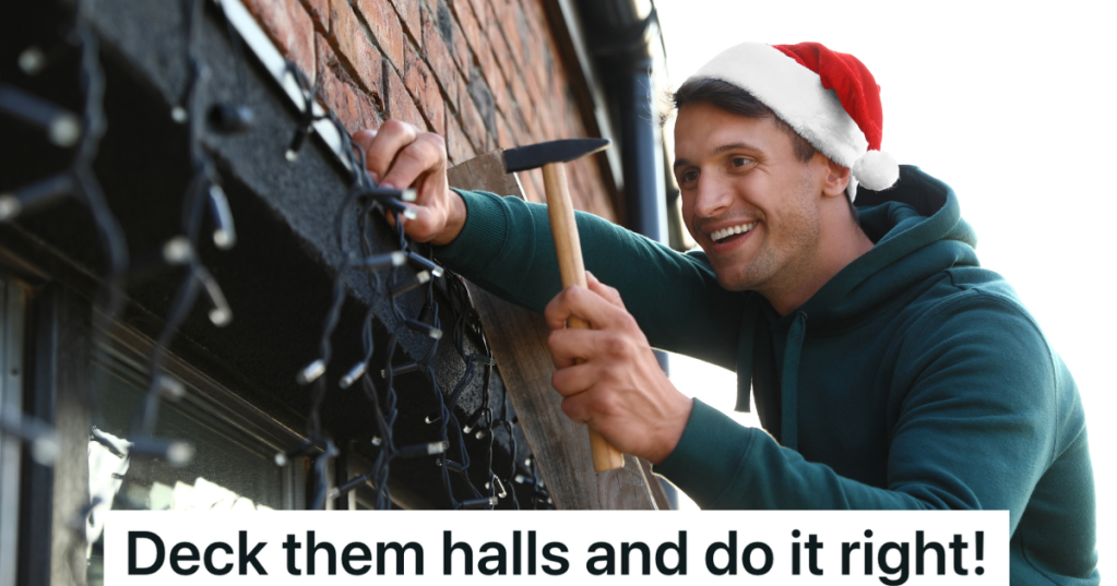 smiling man in Santa hat hanging up Christmas lights outside