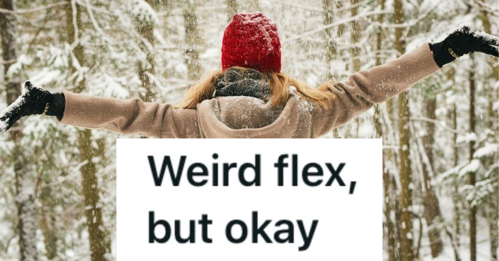 Woman with arms out as it snows