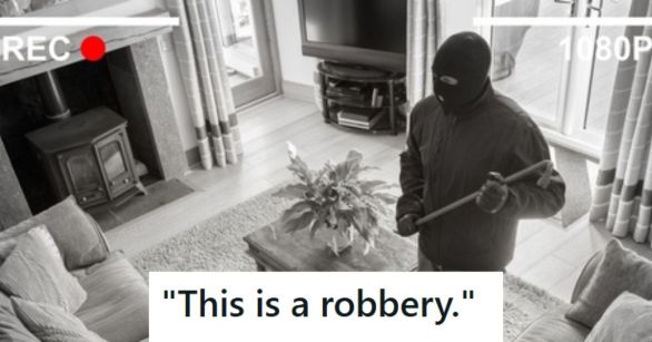 Masked man breaking into a home