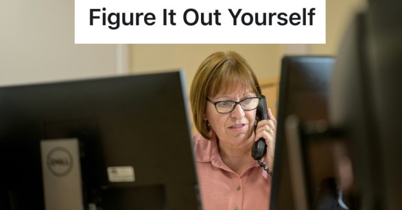 harried woman on the phone at work