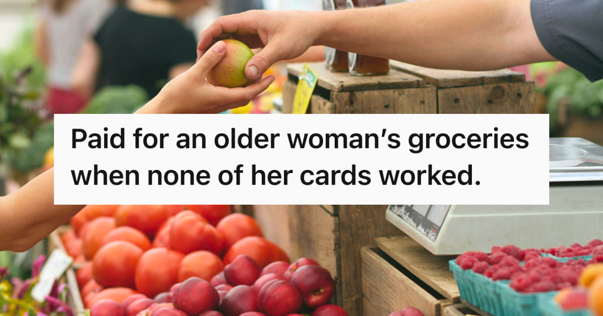 cashier handing a customer a piece of fruit