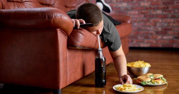 lazy man lying on couch