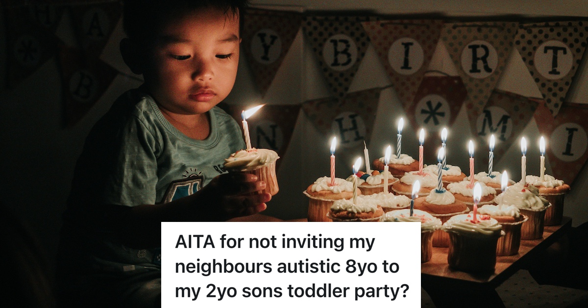 little boy holding a cupcake with a candle on it