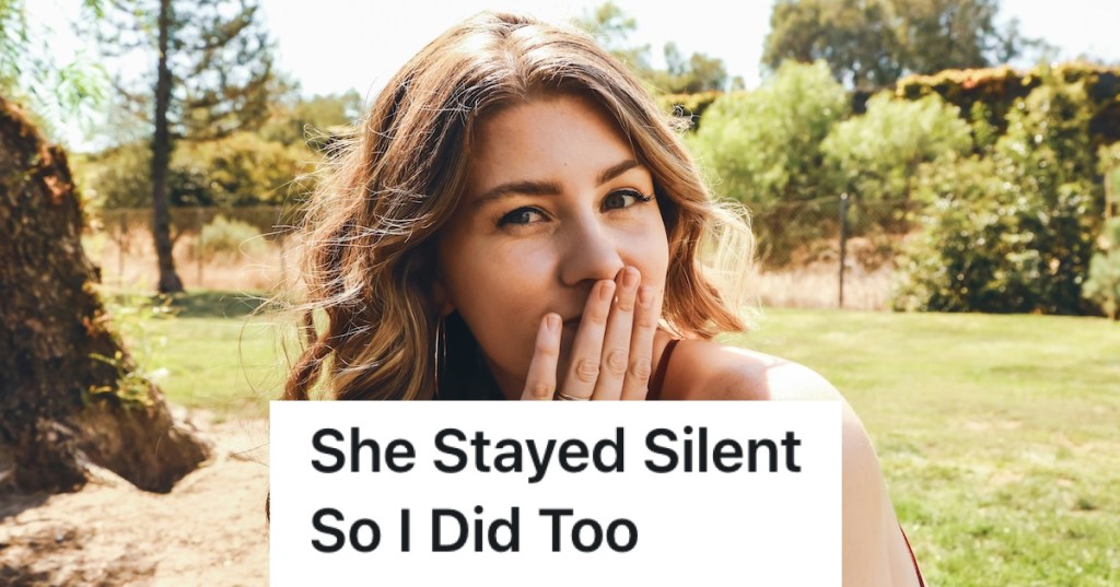 woman with her hand over her mouth