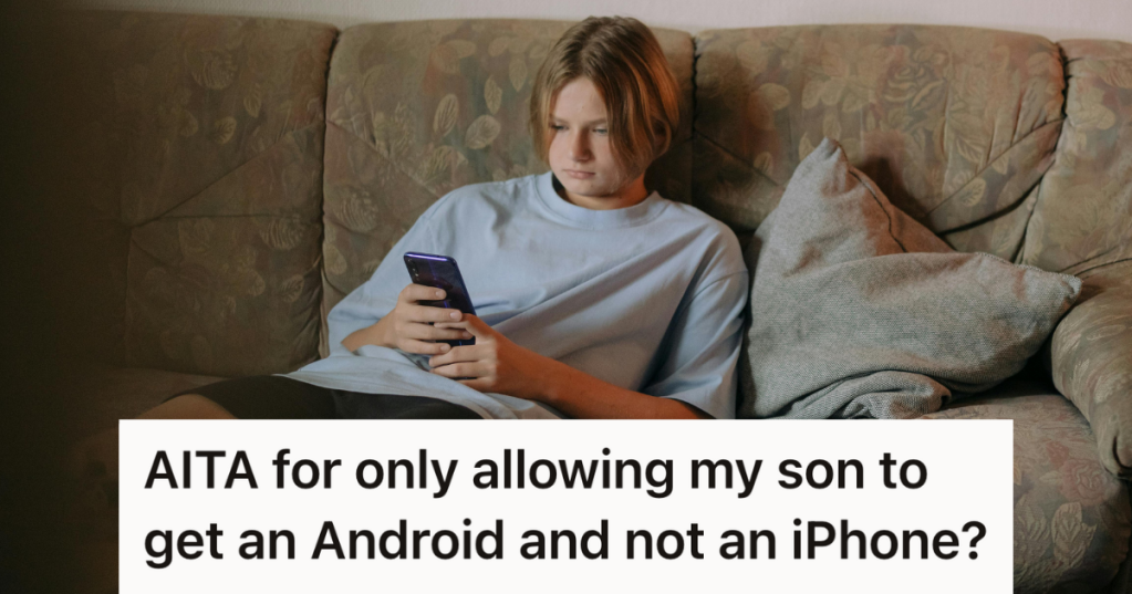 teenage boy sitting on the couch using his phone