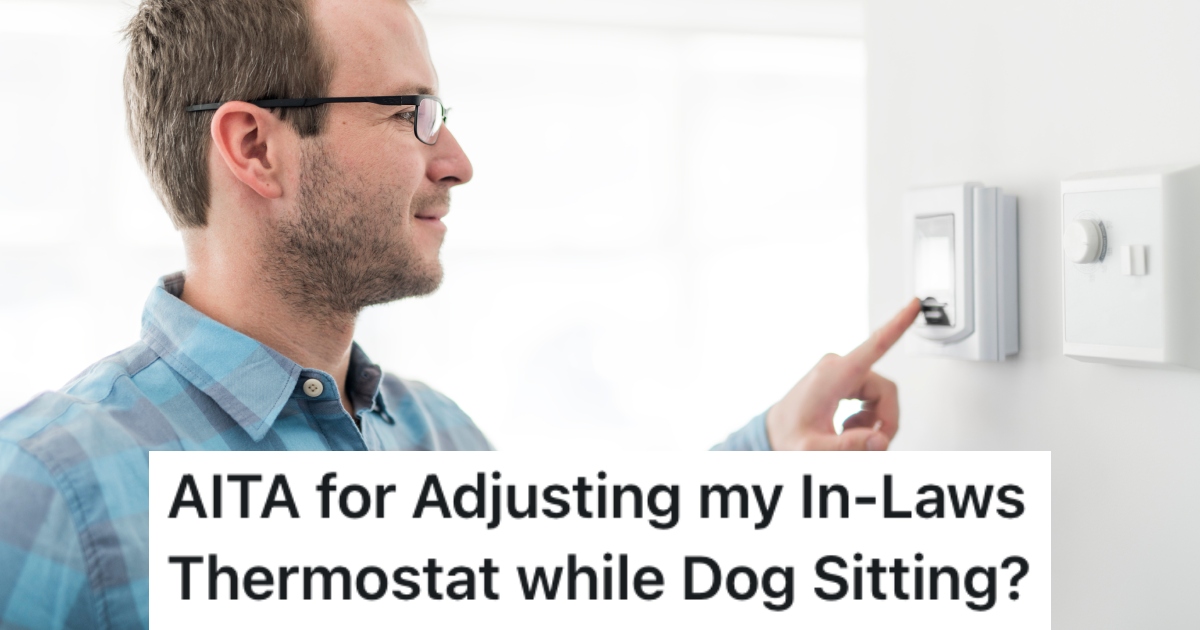 man adjusting a thermostat