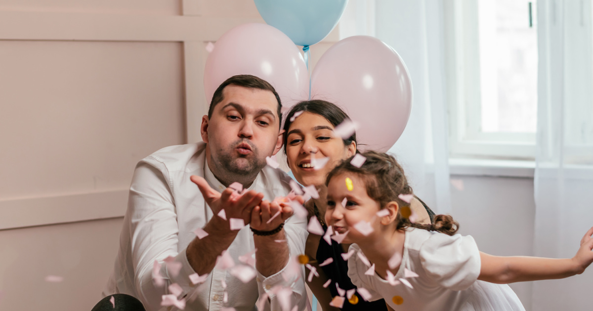 couple learning they are having a second daughter