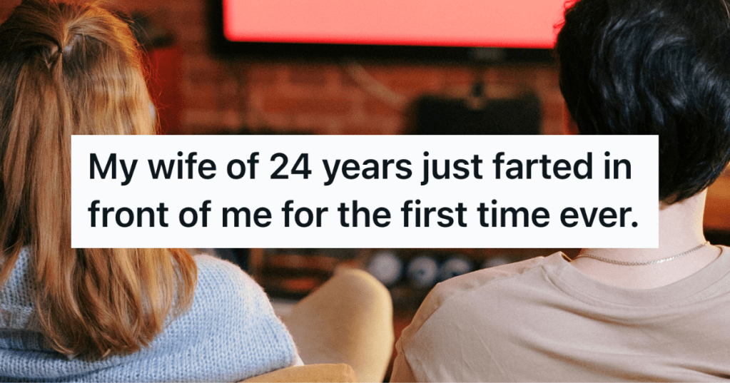 two people sitting on couch watching tv