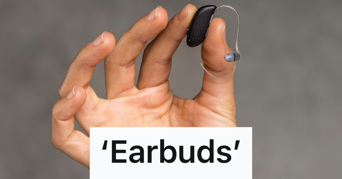 woman holding up earbuds