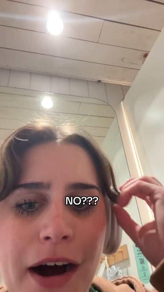 A woman in a dressing room at Cotton On