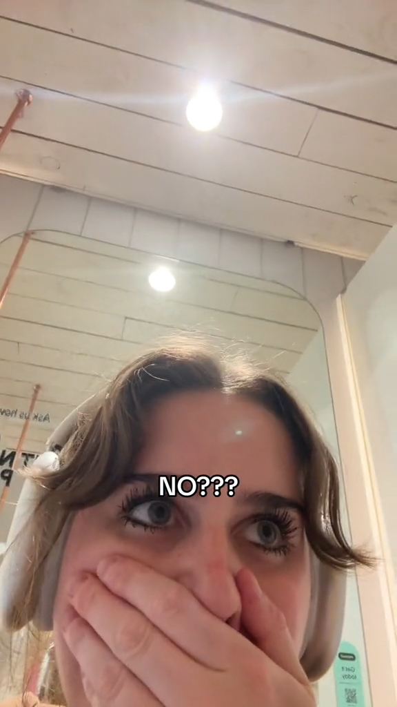 A woman in a dressing room at Cotton On