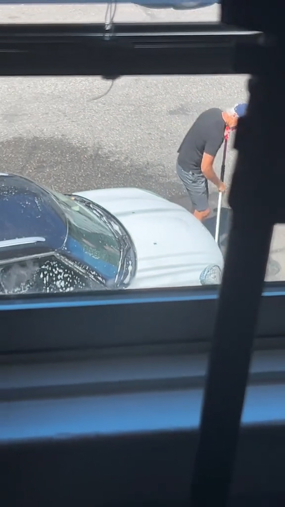 Wyatt watching a man wash his car